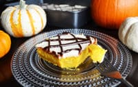 Easy Pumpkin Cake with Cream Cheese Frosting and Drizzled Chocolate sauce